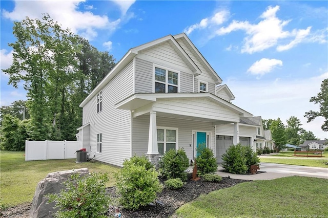 606 N Dickson St, Raeford, NC 28376 - view of front of house featuring concrete driveway, a porch, and an attached garage