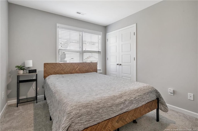 606 N Dickson St, Raeford, NC 28376 - carpeted bedroom with baseboards and a closet