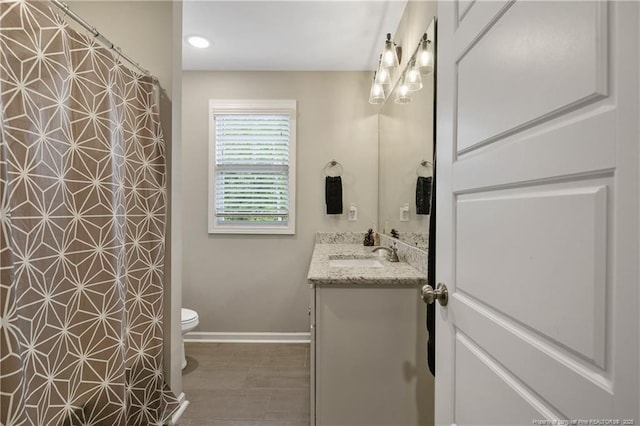 606 N Dickson St, Raeford, NC 28376 - bathroom featuring vanity, a shower with shower curtain, and recessed lighting