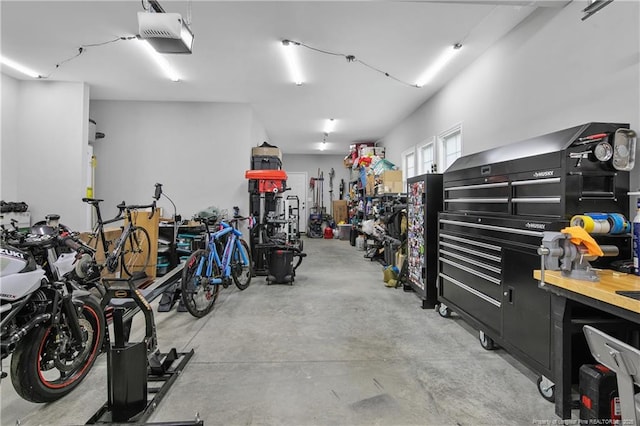606 N Dickson St, Raeford, NC 28376 - garage featuring a garage door opener and a workshop area
