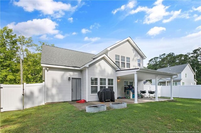 606 N Dickson St, Raeford, NC 28376 - rear view of property with a patio, a gate, a fenced backyard, and roof with shingles