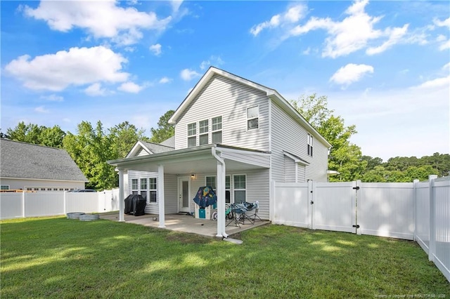 606 N Dickson St, Raeford, NC 28376 - back of house with a gate, a patio area, and a fenced backyard