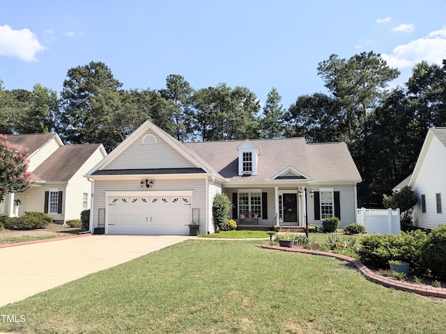904 E Ivy Valley Dr, Fuquay Varina, NC 27526 - cape cod home featuring a garage, concrete driveway, and covered porch