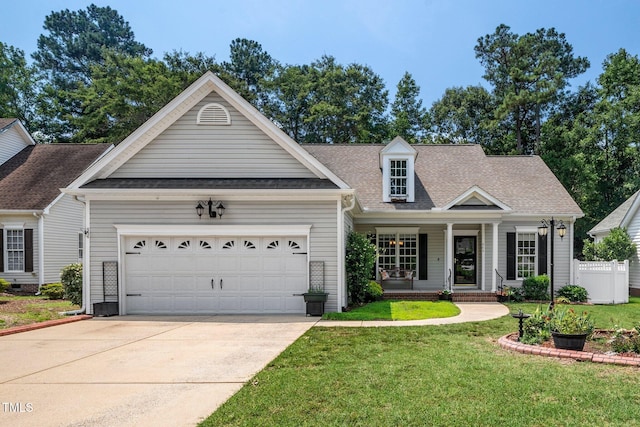 904 E Ivy Valley Dr, Fuquay Varina, NC 27526 - view of front of home featuring driveway, a garage, a porch, and a shingled roof
