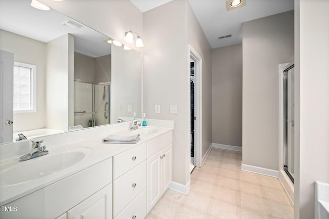 904 E Ivy Valley Dr, Fuquay Varina, NC 27526 - bathroom with a shower stall, double vanity, tile patterned floors, and a garden tub