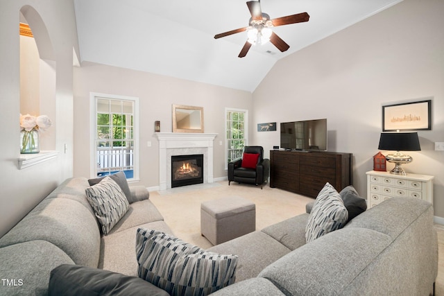 904 E Ivy Valley Dr, Fuquay Varina, NC 27526 - living area with carpet flooring, arched walkways, a ceiling fan, vaulted ceiling, and a high end fireplace
