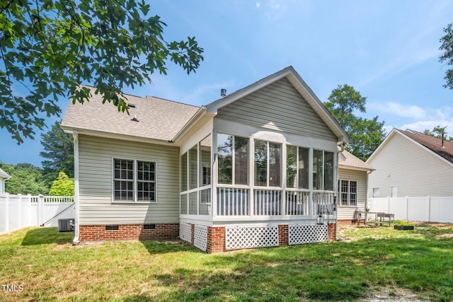 904 E Ivy Valley Dr, Fuquay Varina, NC 27526 - back of property featuring crawl space, a sunroom, a shingled roof, and a fenced backyard