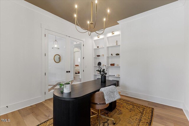 8420 Bells Lake Rd, Apex, NC 27539 - office area featuring a chandelier and light wood-type flooring