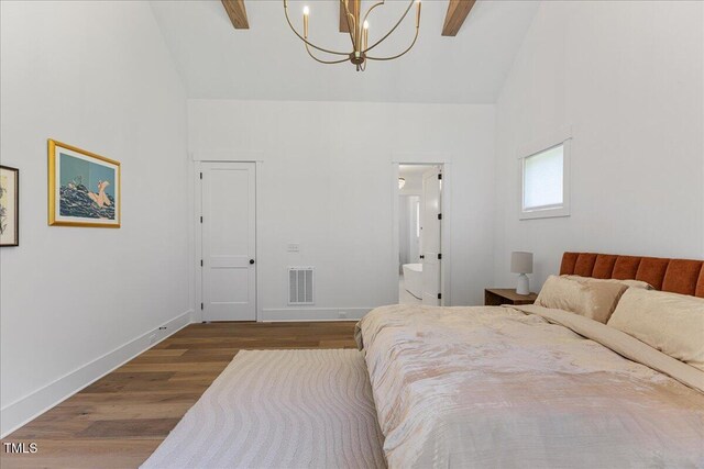 8420 Bells Lake Rd, Apex, NC 27539 - bedroom featuring high vaulted ceiling, a chandelier, wood finished floors, ensuite bathroom, and ceiling fan