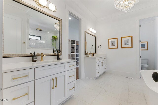 8420 Bells Lake Rd, Apex, NC 27539 - full bath with marble finish floors, two vanities, tiled shower, a freestanding tub, and a chandelier