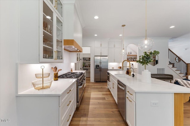 8420 Bells Lake Rd, Apex, NC 27539 - kitchen with appliances with stainless steel finishes, light wood-style flooring, white cabinetry, recessed lighting, and light countertops