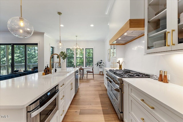 8420 Bells Lake Rd, Apex, NC 27539 - kitchen featuring double oven range, premium range hood, crown molding, white cabinetry, and light wood finished floors
