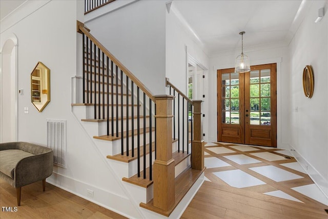 8420 Bells Lake Rd, Apex, NC 27539 - foyer entrance with wood finished floors, french doors, and stairs