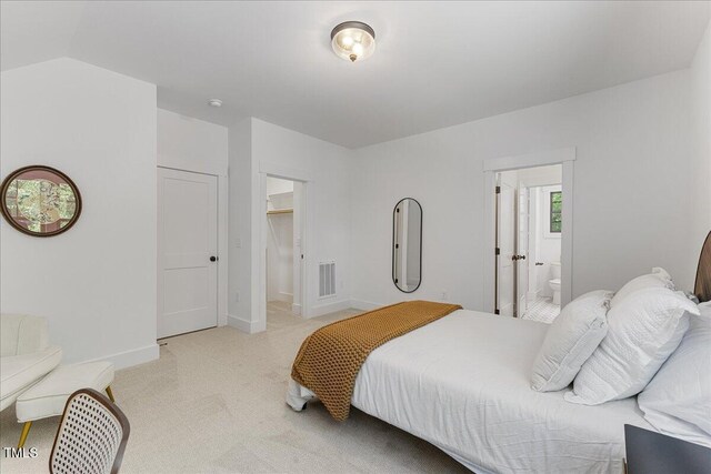 8420 Bells Lake Rd, Apex, NC 27539 - bedroom featuring light colored carpet, a walk in closet, and ensuite bath