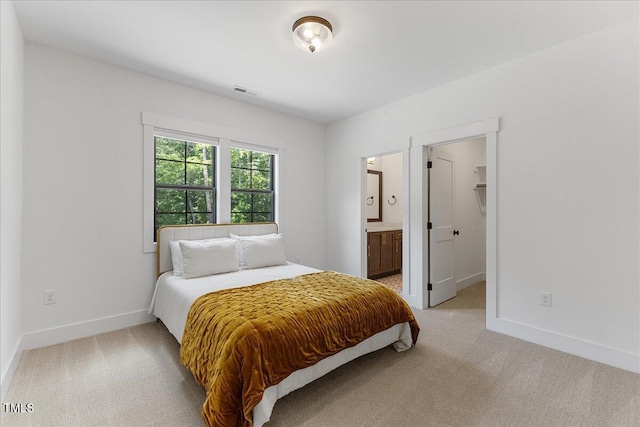 8420 Bells Lake Rd, Apex, NC 27539 - bedroom featuring light carpet, connected bathroom, and a walk in closet