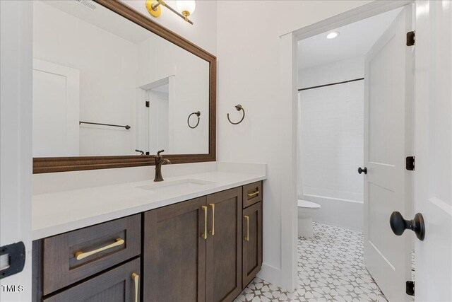 8420 Bells Lake Rd, Apex, NC 27539 - bathroom featuring vanity, shower / tub combination, and recessed lighting