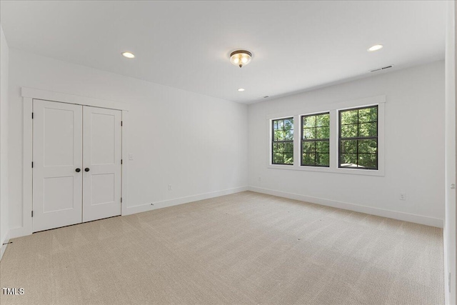 8420 Bells Lake Rd, Apex, NC 27539 - spare room with light colored carpet and recessed lighting