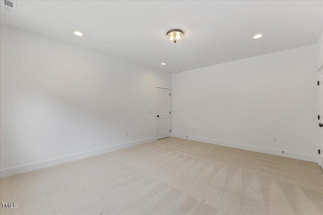 8420 Bells Lake Rd, Apex, NC 27539 - empty room featuring light colored carpet and recessed lighting