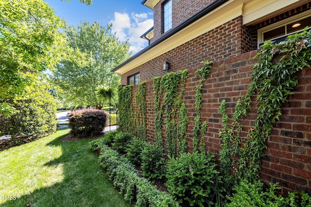 145 Cofield Cir, Durham, NC 27707 - view of property exterior with brick siding and a lawn