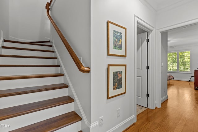 145 Cofield Cir, Durham, NC 27707 - stairs with wood finished floors and crown molding