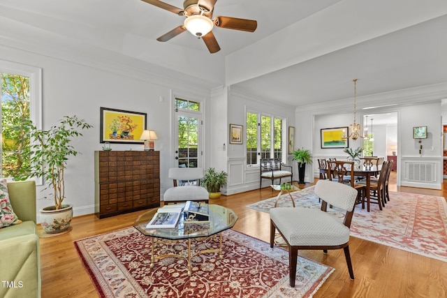 145 Cofield Cir, Durham, NC 27707 - living area with ceiling fan, ornamental molding, wood finished floors, and a chandelier