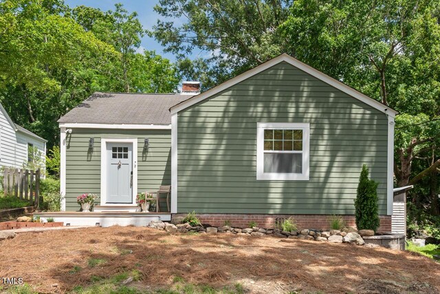 2410 Huron St, Durham, NC 27707 - view of front facade featuring a chimney