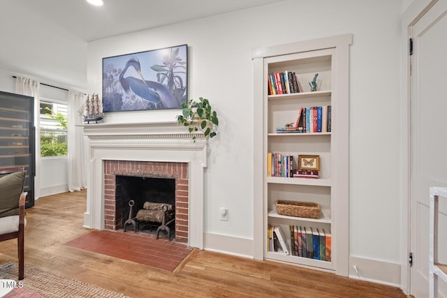 2410 Huron St, Durham, NC 27707 - living room with a fireplace, wood finished floors, and recessed lighting