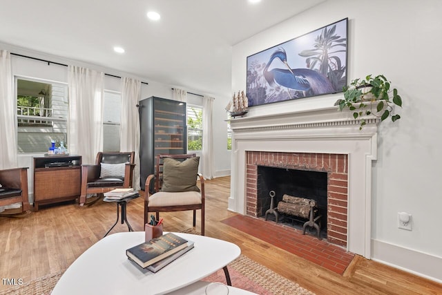2410 Huron St, Durham, NC 27707 - living room with a fireplace, wood finished floors, and recessed lighting