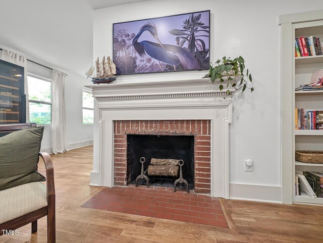 2410 Huron St, Durham, NC 27707 - detailed view of a brick fireplace and wood finished floors