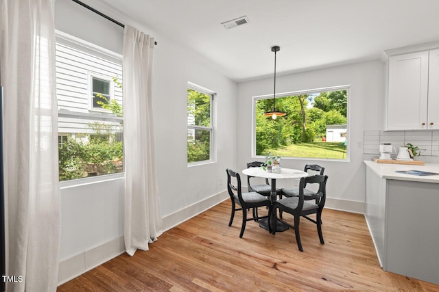 2410 Huron St, Durham, NC 27707 - dining space with baseboards and light wood-type flooring