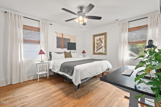 2410 Huron St, Durham, NC 27707 - bedroom with wood finished floors and ceiling fan