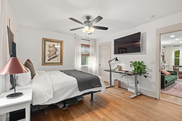 2410 Huron St, Durham, NC 27707 - bedroom with wood finished floors and ceiling fan