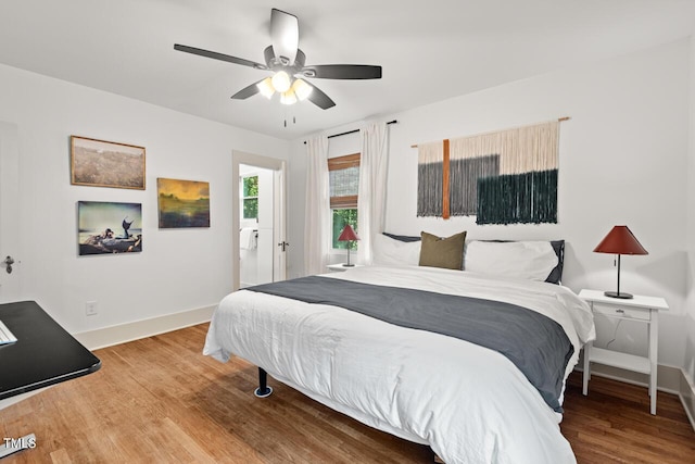 2410 Huron St, Durham, NC 27707 - bedroom with wood finished floors and a ceiling fan