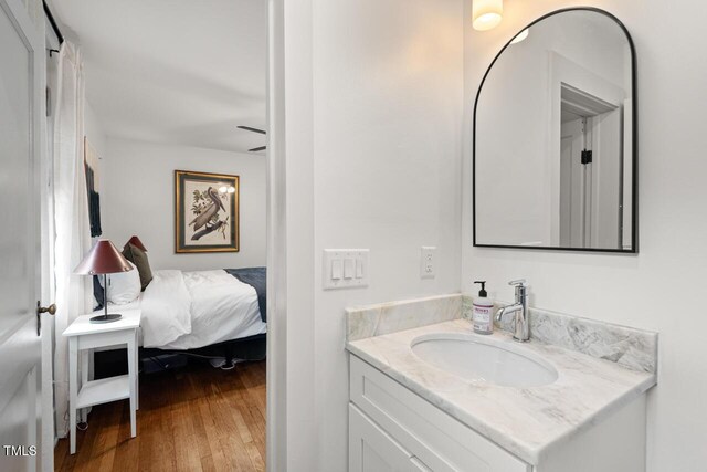 2410 Huron St, Durham, NC 27707 - bathroom with vanity and wood finished floors