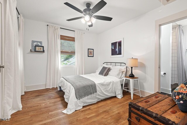 2410 Huron St, Durham, NC 27707 - bedroom with wood finished floors and a ceiling fan