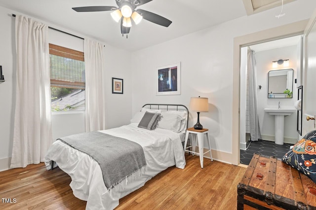 2410 Huron St, Durham, NC 27707 - bedroom featuring wood finished floors and a ceiling fan