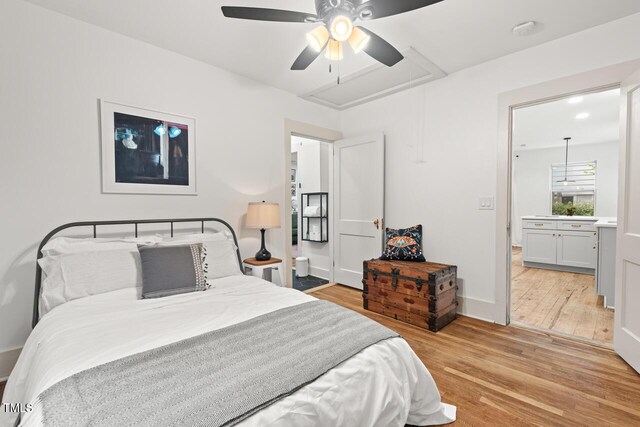 2410 Huron St, Durham, NC 27707 - bedroom with light wood-type flooring, attic access, a ceiling fan, and ensuite bath
