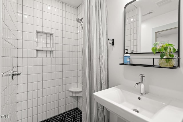 2410 Huron St, Durham, NC 27707 - full bathroom featuring a tile shower and a sink