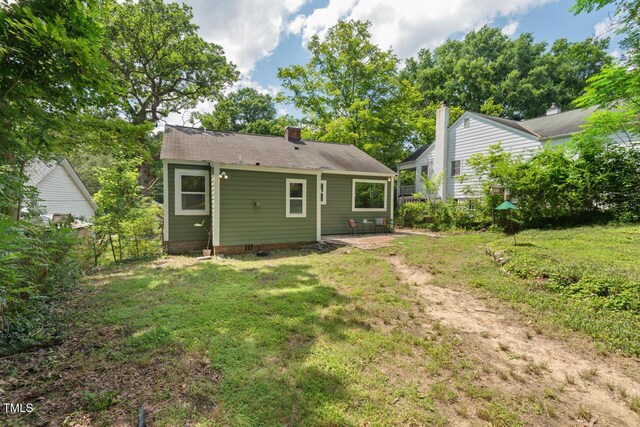 2410 Huron St, Durham, NC 27707 - rear view of house featuring a chimney