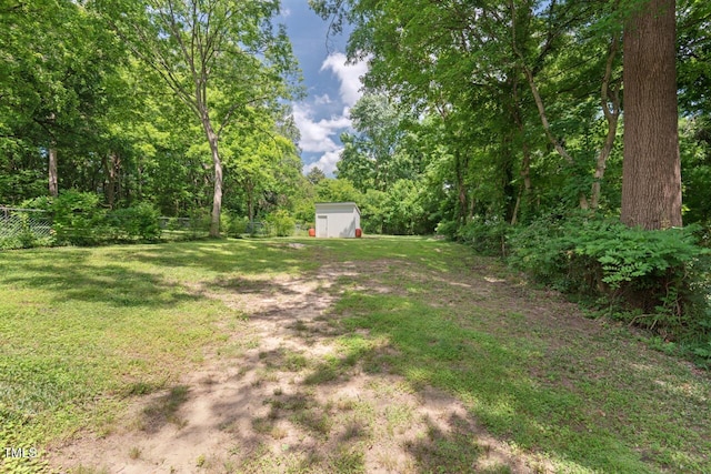 2410 Huron St, Durham, NC 27707 - view of yard featuring a shed and a wooded view