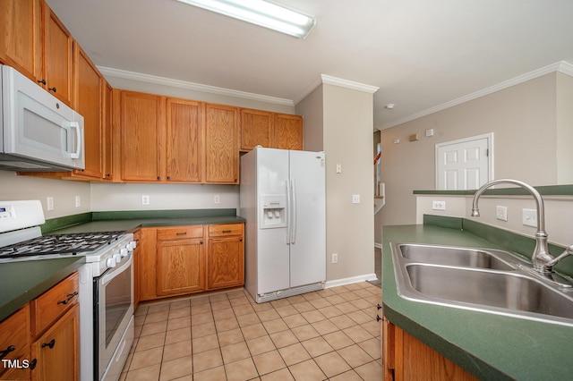 2261 Plum Frost Dr, Raleigh, NC 27603 - kitchen with white appliances, ornamental molding, light tile patterned floors, dark countertops, and brown cabinetry