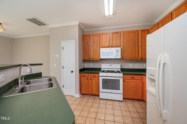 2261 Plum Frost Dr, Raleigh, NC 27603 - kitchen with white appliances, ornamental molding, light tile patterned floors, dark countertops, and brown cabinets
