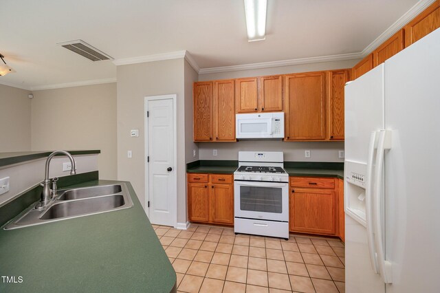 2261 Plum Frost Dr, Raleigh, NC 27603 - kitchen with white appliances, ornamental molding, light tile patterned floors, dark countertops, and brown cabinets
