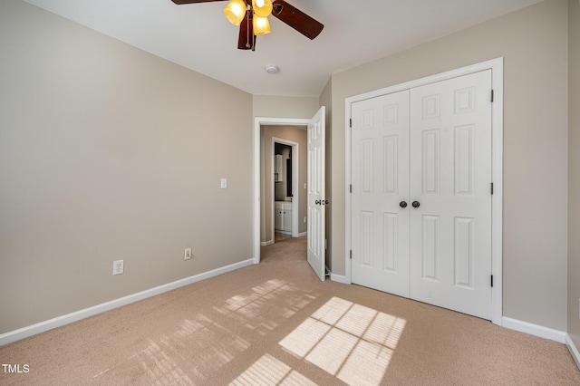 2261 Plum Frost Dr, Raleigh, NC 27603 - unfurnished bedroom with light carpet, a closet, and a ceiling fan