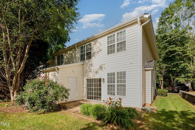 2261 Plum Frost Dr, Raleigh, NC 27603 - rear view of property with a lawn and a patio area