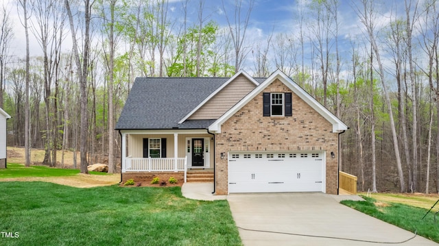 3041 Wesley Farm Ln, Sophia, NC 27350 - view of front of house featuring covered porch, driveway, a front lawn, and brick siding