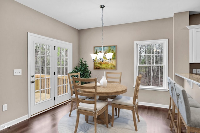 3041 Wesley Farm Ln, Sophia, NC 27350 - dining area featuring a chandelier and dark wood finished floors