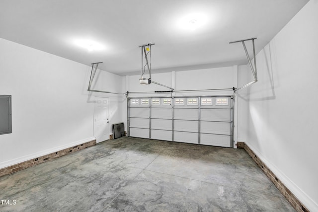 3041 Wesley Farm Ln, Sophia, NC 27350 - garage featuring a garage door opener and baseboards