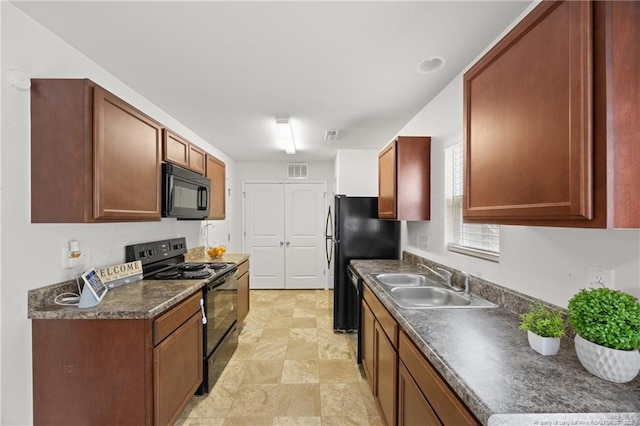 534 Jernigan St, Fayetteville, NC 28306 - kitchen with black appliances and dark countertops