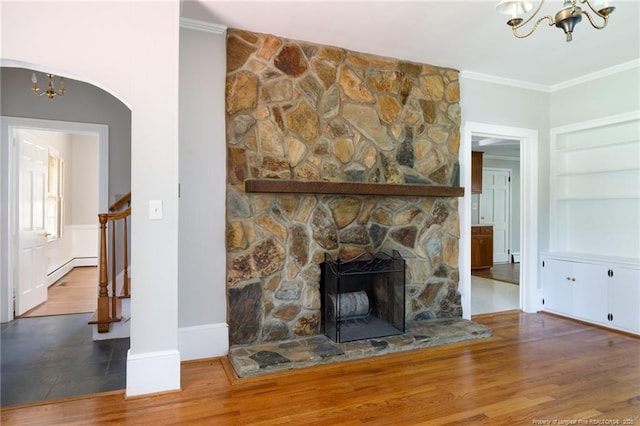 103 Stedman St, Fayetteville, NC 28305 - unfurnished living room featuring a chandelier, wood finished floors, built in features, ornamental molding, and stairway